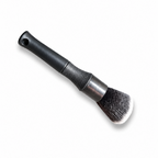 Close-up of the Ultra Soft Detail Brush dense feather-soft synthetic bristles and textured grip